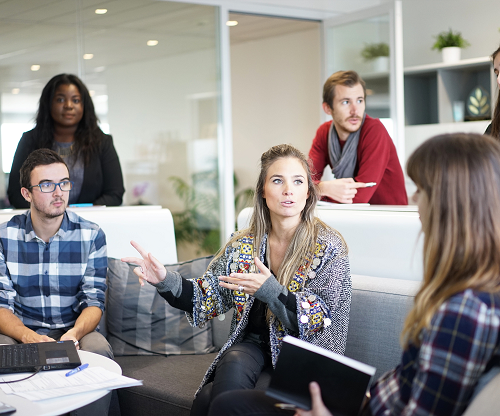 Group of workers seated in a casual office talking